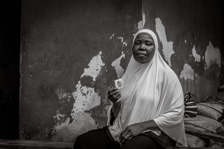 Rabiat holds a photograph of her husband who died in 2001.