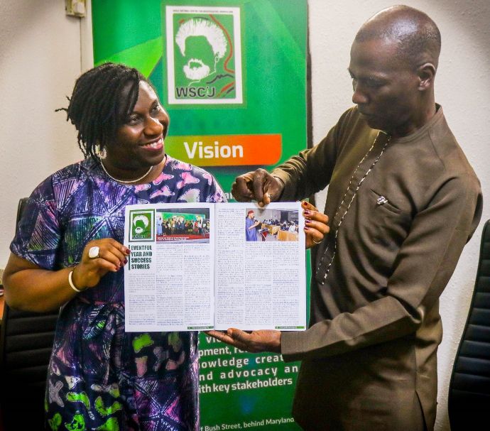 An MCDN publication supported by WSCIJ being presented to Alaka 